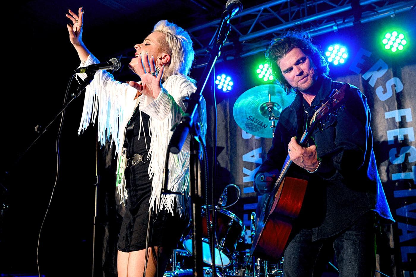 Producers of OSF, Jen Slocumb and Rob Slocumb of Martha's Trouble perform during Larry Mitchell's Late Night Jam at John Emerald Distilling Company during the Opelika Songwriters Festival