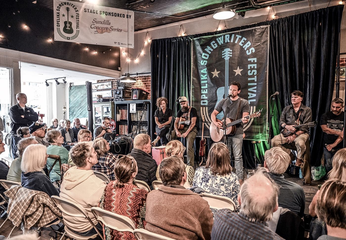 Kassie Wilson and Ben Wilson of Goldpine with Mike Kinnebrew, Nelson Nolen and Wyatt Espalin perform at Market Street Coffee during Gospel Hour